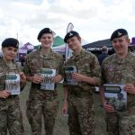 Army cadets hold brochures